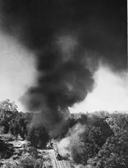 Smoke Prints: A thick columns of black smoke rising from a Japanese train attacked by Bristol
