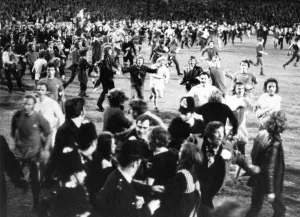 Thousands of Birmingham City fans swarm onto the pitch after their team clinched