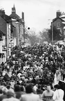 00379 Prints: Thousands of villagers line the streets of Atherstone for the traditional Shrove Tuesday