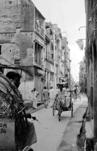 Tikka Khan Street Dacca flying Pakistan flags from the windows following the fighting