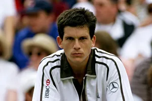 Despair Prints: Tim Henman looks dejected after losing to Pete Sampras in the mens single
