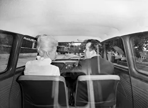 Instruction Prints: Tina Butler, woman driving instructor seen here giving a driving lesson