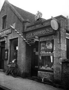 The tobacconist shop in the village of Ballater, Scotland. September 1958