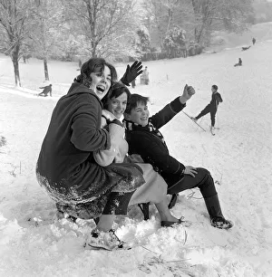 Sleighs Prints: Tobogganists wave to the Mirror photographer before descending Hampstead Heath aboard