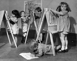 Toddlers at Hampstead day nursery paint pictures in their very own art studio 26th