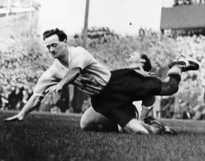 Falling Prints: Tom Finney brought to the ground while playing for Preston North End October 1958