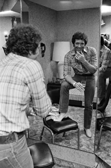 Tom Jones in concert in America. Pictured relaxing backstage. April 1983