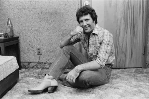 01336 Prints: Tom Jones in concert in America. Pictured relaxing backstage. April 1983