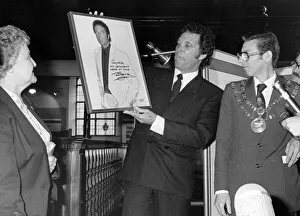 Tom Jones presents his photograph to the Pontypridd Historical