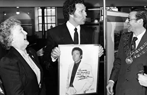 Tom Jones presents his photograph to the Pontypridd Historical