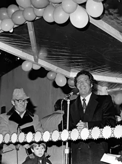 Lights Prints: Tom Jones turns on the Christmas lights in his hometown of Pontypridd, Wales