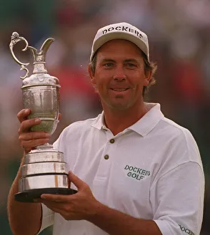 Tom Lehman holds claret jug trophy British Open golf champion Lytham Dockers cap