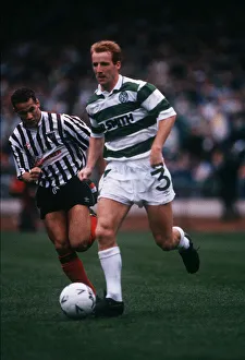 Jon Scan Prints: Tommy Burns runs past George O Boyle November 1989