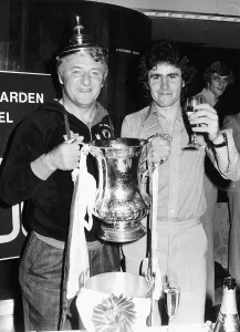 Tommy Docherty Football Manager holding FA Cup with the lid on his head