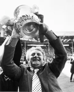 Tommy Docherty manager of Manchester United May 1977 holds up the FA Cup after