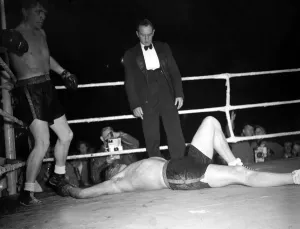 Tommy Farr looks down on his opponent Jan Klein when they met 27 / 9 / 1950