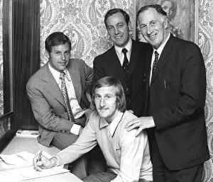 Tommy Hutchison signs for Coventry City in his bedroom at the Hotel Leofric on his
