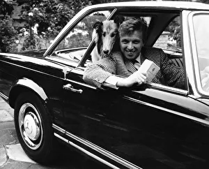 Collie Prints: Tommy Steele actor at his home at Hampton Wick - in his car with his collie dog
