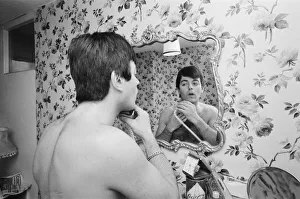 01036 Prints: Tony Blackburn, the 22 year old Disc Jockey, washes and shaves early in the morning