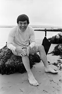 01195 Collection: Tony Blackburn on holiday in Poole, Dorset. Summer weather there has not been very good