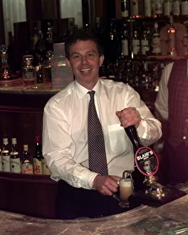 Tony Blair Labour Party leader in a pub pouring a half pint of beer that has been named