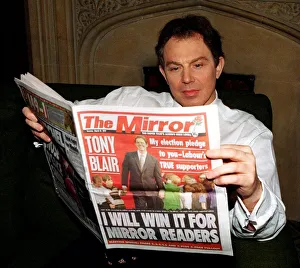 Tony Blair MP Labour Leader reads the Daily Mirror Newspaper at Home