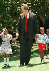 Holding Hands Prints: Tony Blair South Africa Visit January 1999 with the Aids child he sponsors