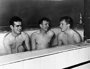 F A Cup Prints: Tony Devreux, Gordon Henry & Dick Renwick of Aldershot FC enjoy a good hot bath
