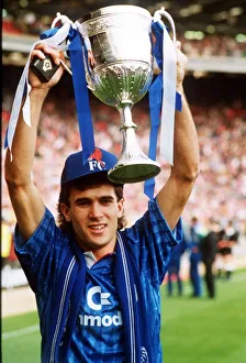 Tony Dorigo Football player for Chelsea holds up the ZDS Zenith Data Systems Trophy
