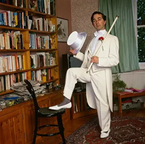 Tony Robinson actor October 1987 wearing white suit tails and hat holding walking stick