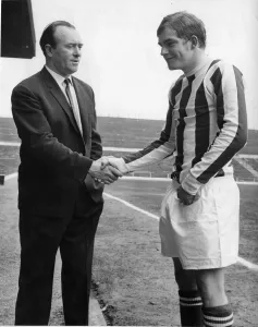 Tony Waddington Stoke City Manager shakes hands with new signing John Mahoney 9th