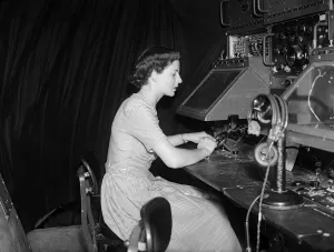 00457 Prints: Topsy Watts, radar tracker at London Airport sits before apparatus with which she has