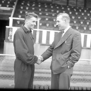 Torquay United manager Eric Webber (right) bidding farewell to Peter Wakeham on hs