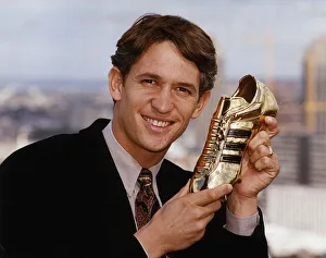 Tottenham Hostpur and England footballer Gary Lineker shows off the Golden Boot award he