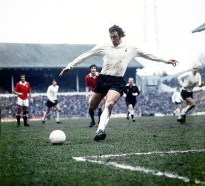 Tottenham Hostpur football player Martin Chivers shoots at goal in a match against