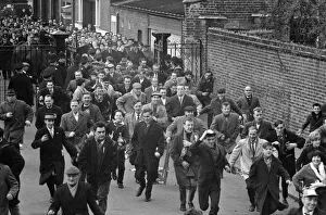 Tottenham Hotspur fans queue at White Hart Lane for tickets for their European Cup match