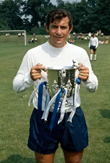 00230 Prints: Tottenham Hotspur footballer Alan Mullery with the League Cup trophy August 1971