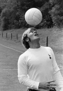 00328 Prints: Tottenham Hotspur footballer Ralph Coates practices his heading skills during the Spurs