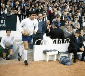 Tottenham Hotspur footballer Terry Venables walk out of the tunnel before his side