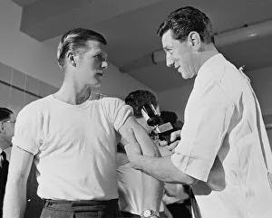 Tottenham Hotspur footballers line up for their flu innocculation