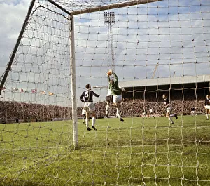 Tottenham Hotspur goalkeeper Pat Jennings makes a save during their English League