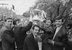 Suits Prints: Tottenham Hotspur players celebrate with the FA Cup trophy on an open top bus parade in