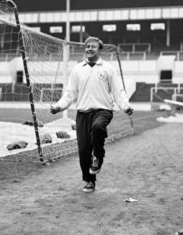 Tottenham Hotspur winger Terry Medwin trains alone at White Hart Lane in a race for