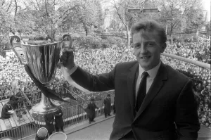Core93 Prints: Tottenham Hotspurs Terry Dyson holding the European Cup Winners Cup Winners trophy