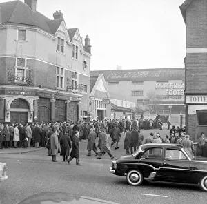 Tottenham supporters queue outside White Hart Lane for tickets to their European Cup