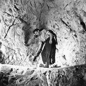 Tourist in the West Wycombe Caves also known as The Hell Fire Caves which are a network