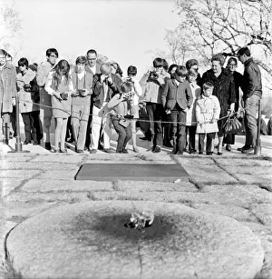 States Prints: Tourists with their cameras observe the eternal flame at the grave of slain American