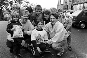 Collection Prints: Town footballers Simon Webster (left) and Julian Winter size up young Jason Rushworth for