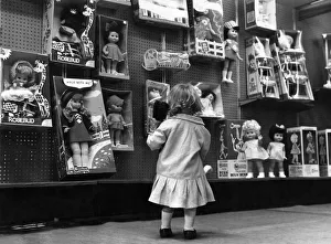 Store Prints: Toys: Dolls: Sheila Matton seen here in a little girls heavan looks at toy dolls in a