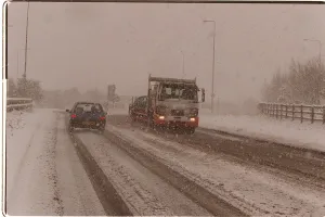 Blizzard Prints: Traffic driving along a snow covered road in kent after Britain was hit by the Big Freeze